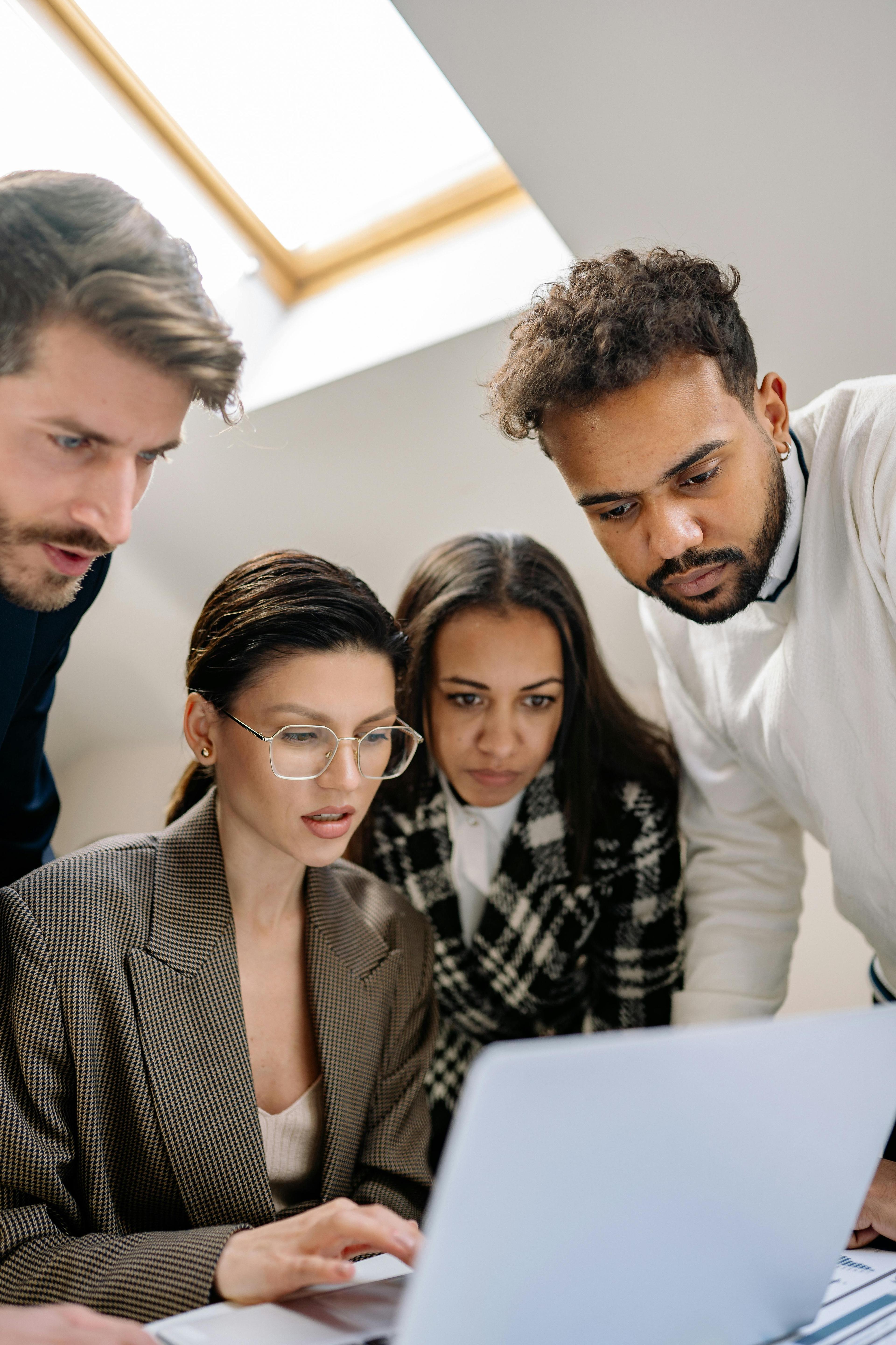 A specialist support team reviewing a service platform together.