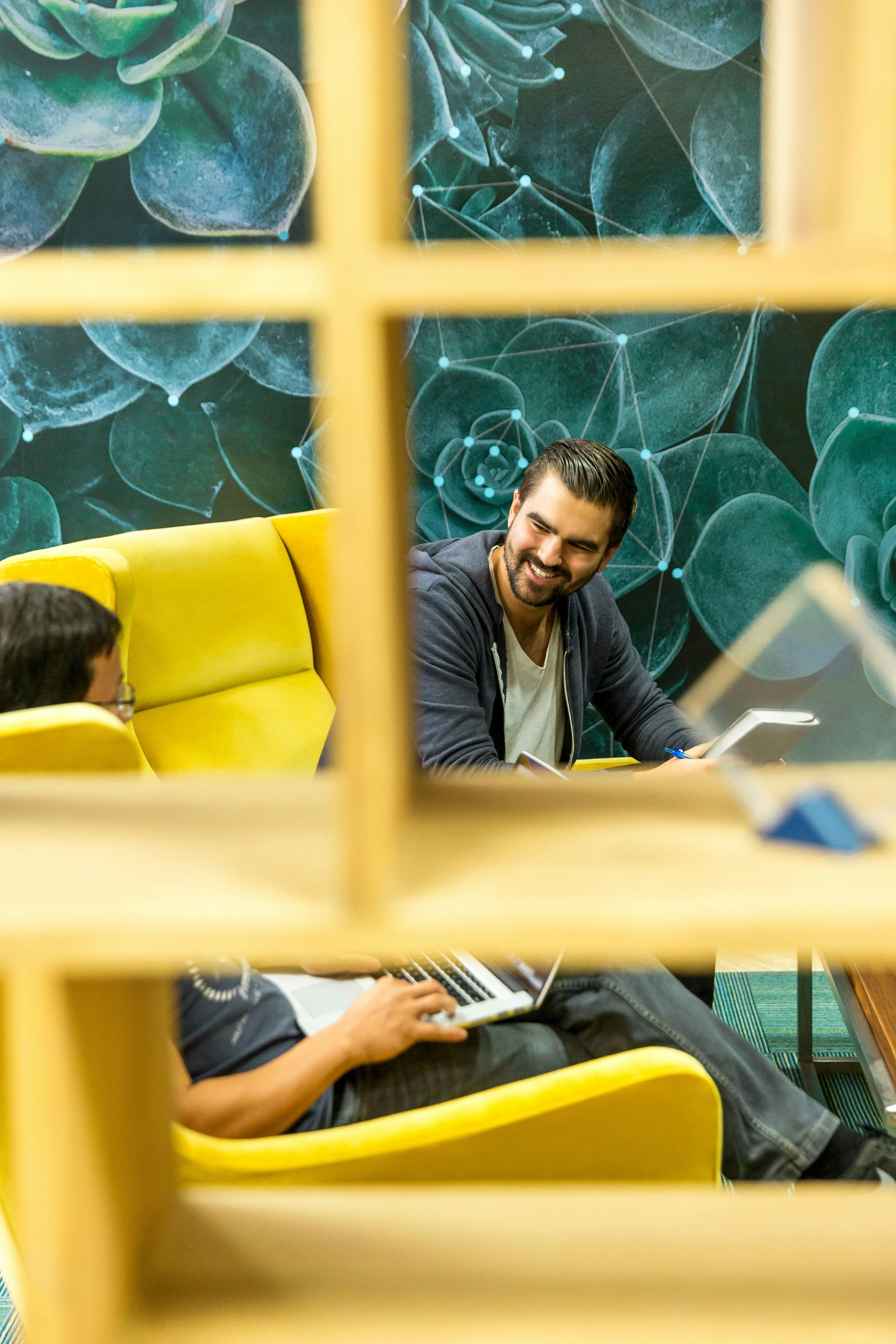 People collaborating in a bright office lounge